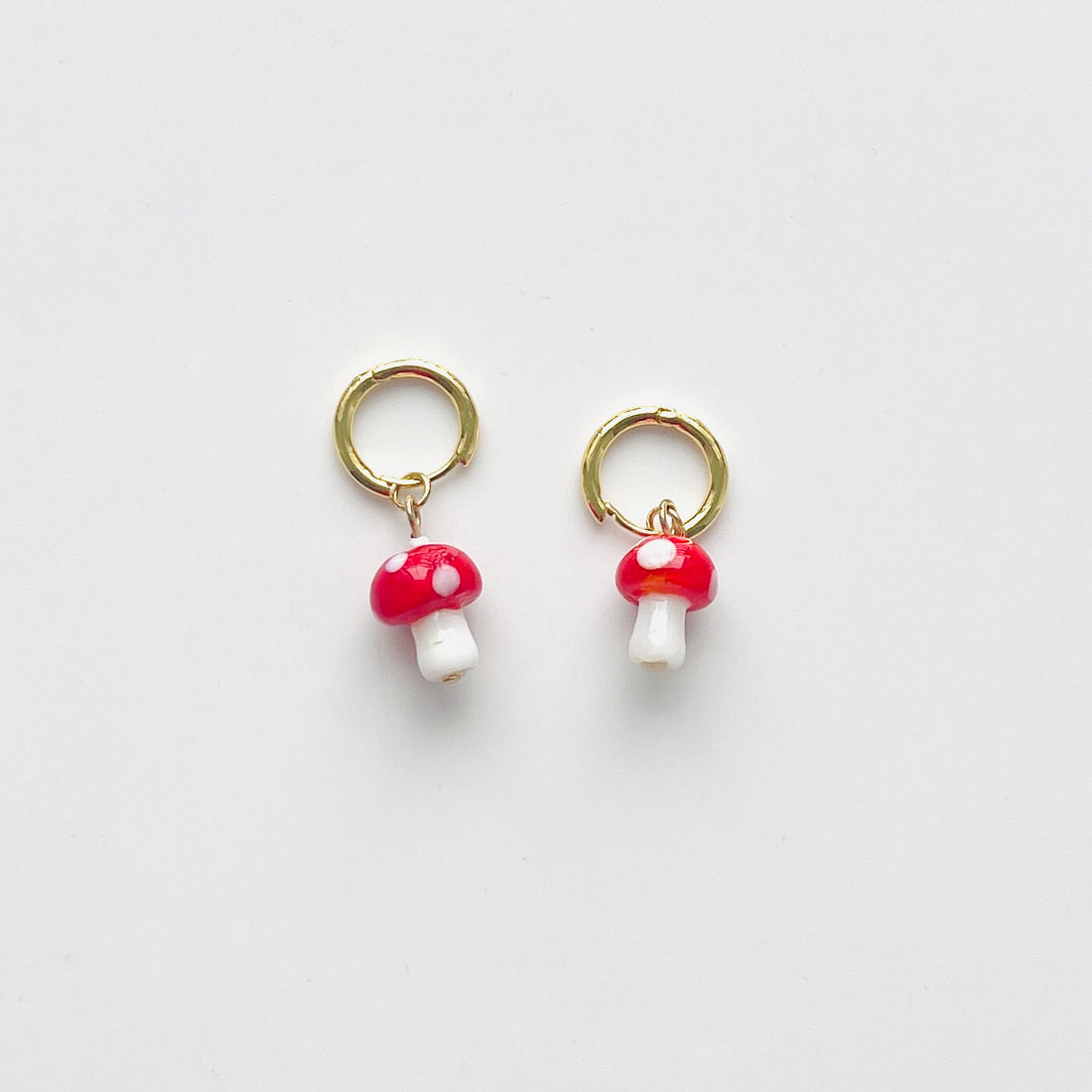 Gold plated hoop earrings with mushroom charms