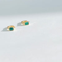 Green gem Huggie earrings in gold tone