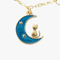 charm bracelet with moon and cat charms in gold