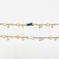 charm bracelet with fujisan and cat charms in gold