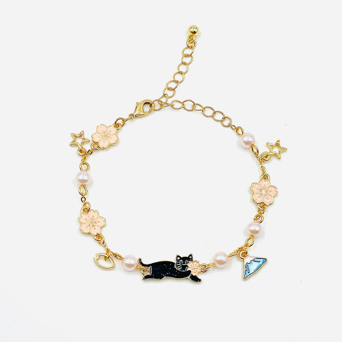 charm bracelet with fujisan and cat charms in gold