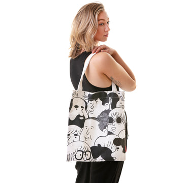 black & white tote bag with funky faces artwork