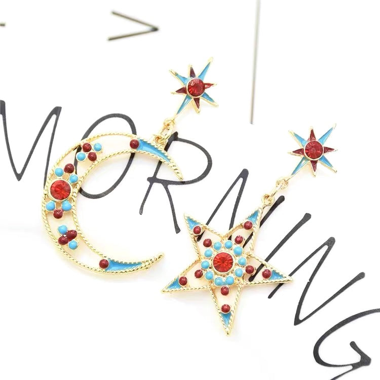 moon and star motifs drop earrings