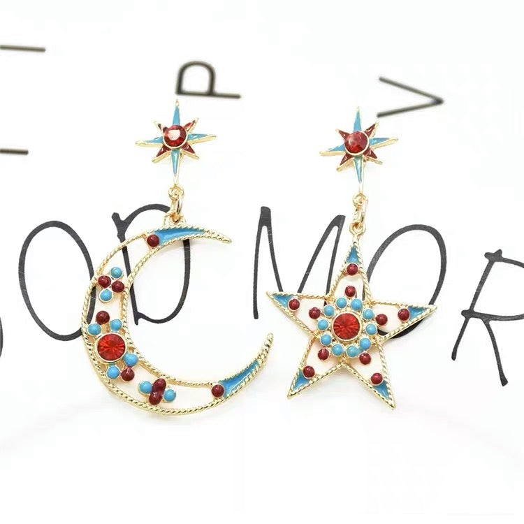moon and star motifs drop earrings