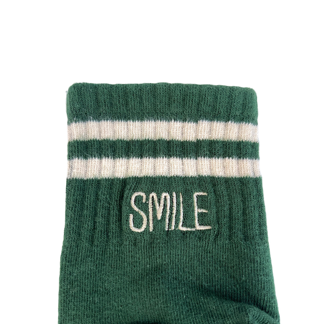 Green & white socks with "SMILE" word embroidered