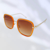 Small square sunglasses in orange with classy gold arm