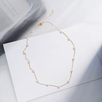 Pearl necklace in gold tone