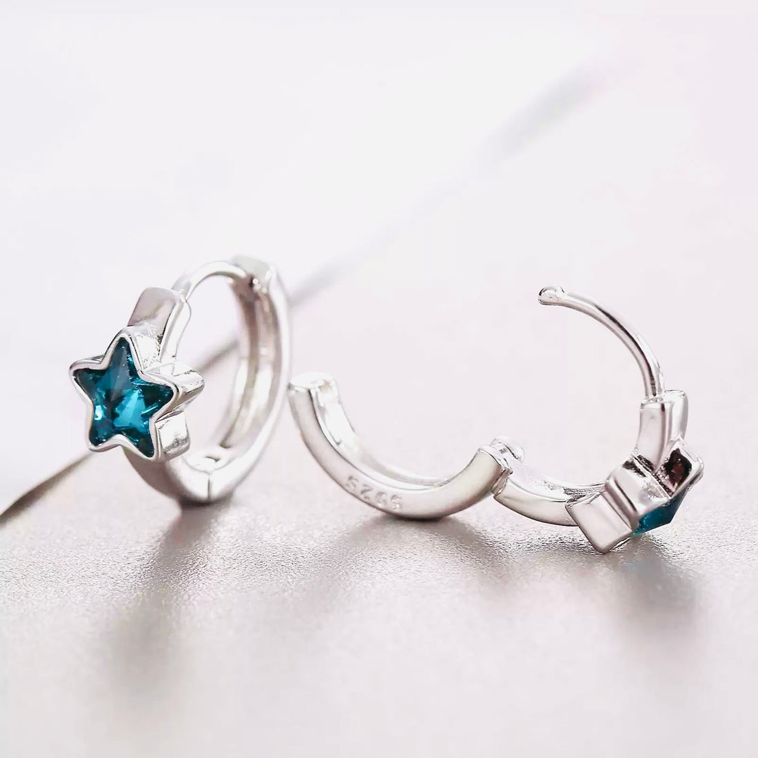 Silver hoop with blue star