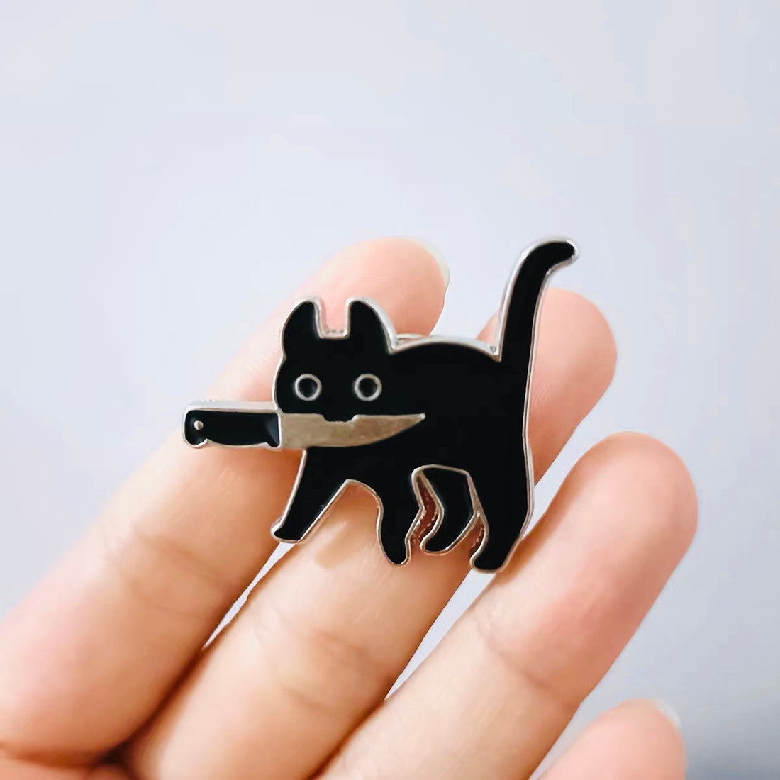 Dangerous cat brooch