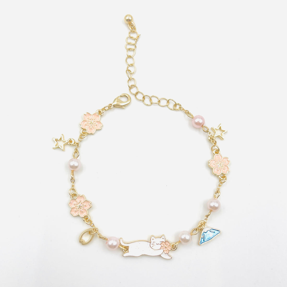 charm bracelet with fujisan and cat charms in gold