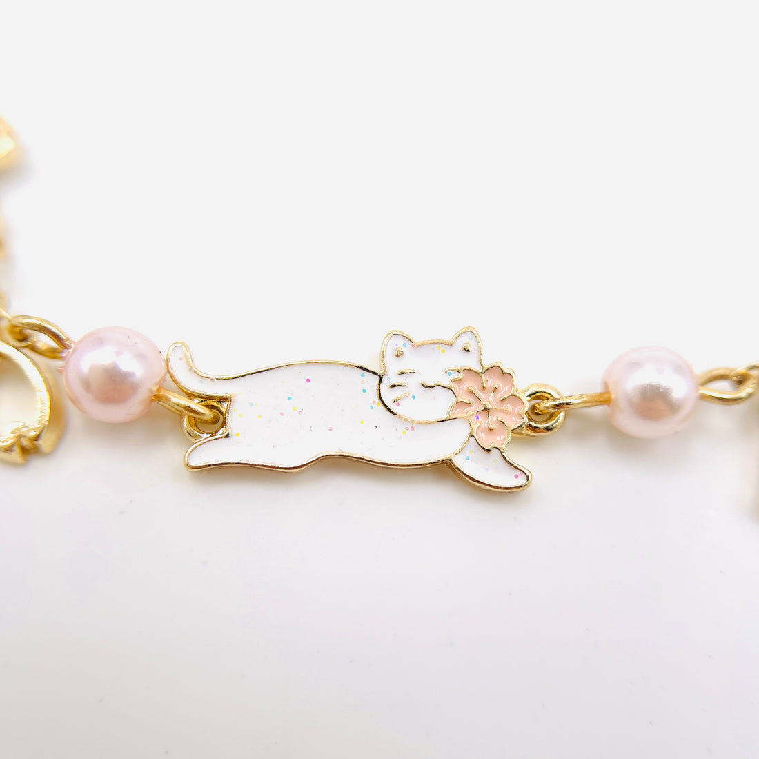 charm bracelet with fujisan and cat charms in gold